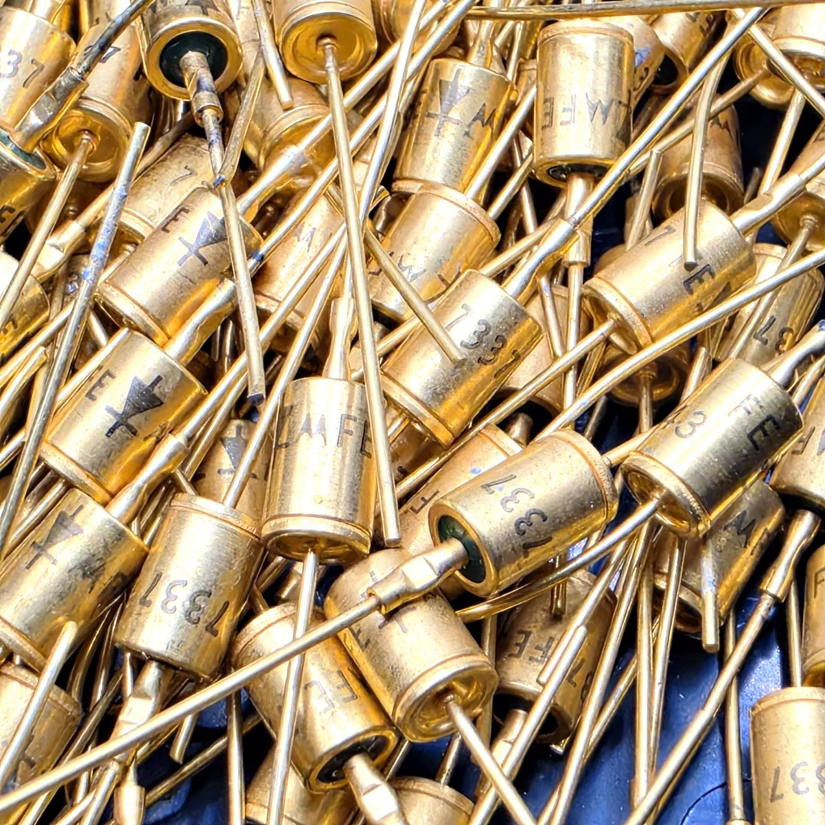 Motorola axial diode marked FE 7331 gold metal case for vintage electronics repair from American Industrial Parts Group