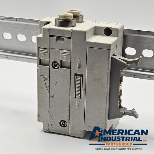 SMC pneumatic valve manifold end block DIN rail view, industrial automation MRO pneumatic manifold mounting component. American Industrial Parts Group.