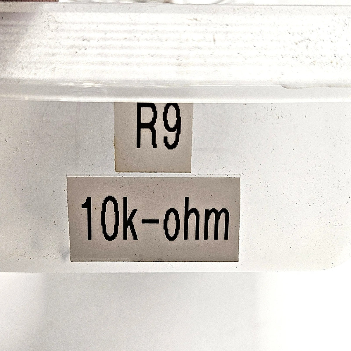 10K ohm 10% axial lead fixed resistor brown black orange silver through-hole for circuit board repair and vintage electronics restoration