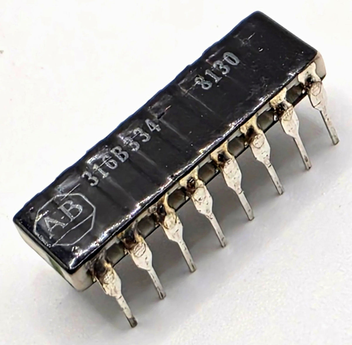 Allen-Bradley 316B334 330K ohm isolated resistor network DIP-16 from American Industrial Parts Group