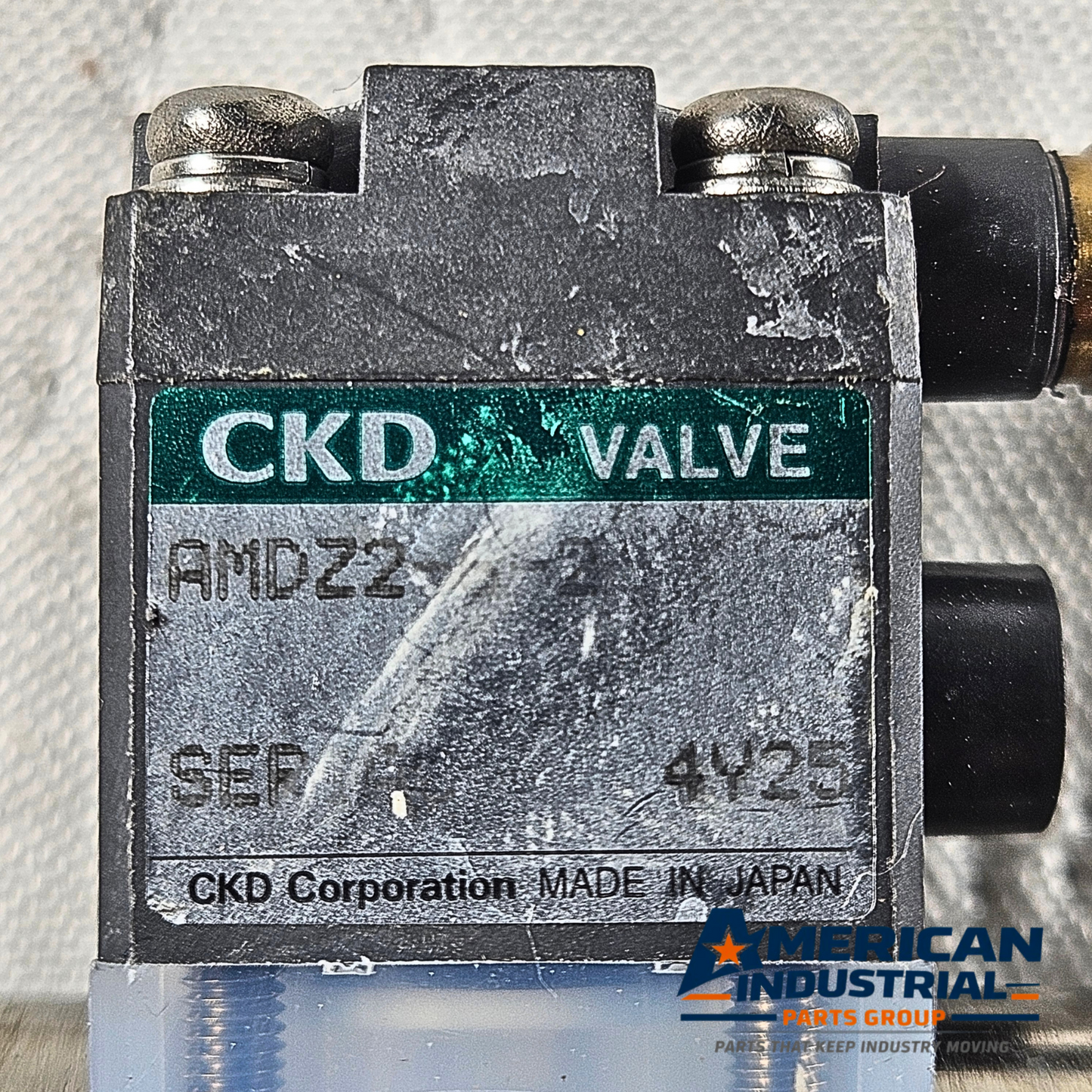 CKD AMD22 4V2 pneumatic solenoid air valve label detail, 0.4-0.6MPa industrial automation MRO air valve. American Industrial Parts Group.