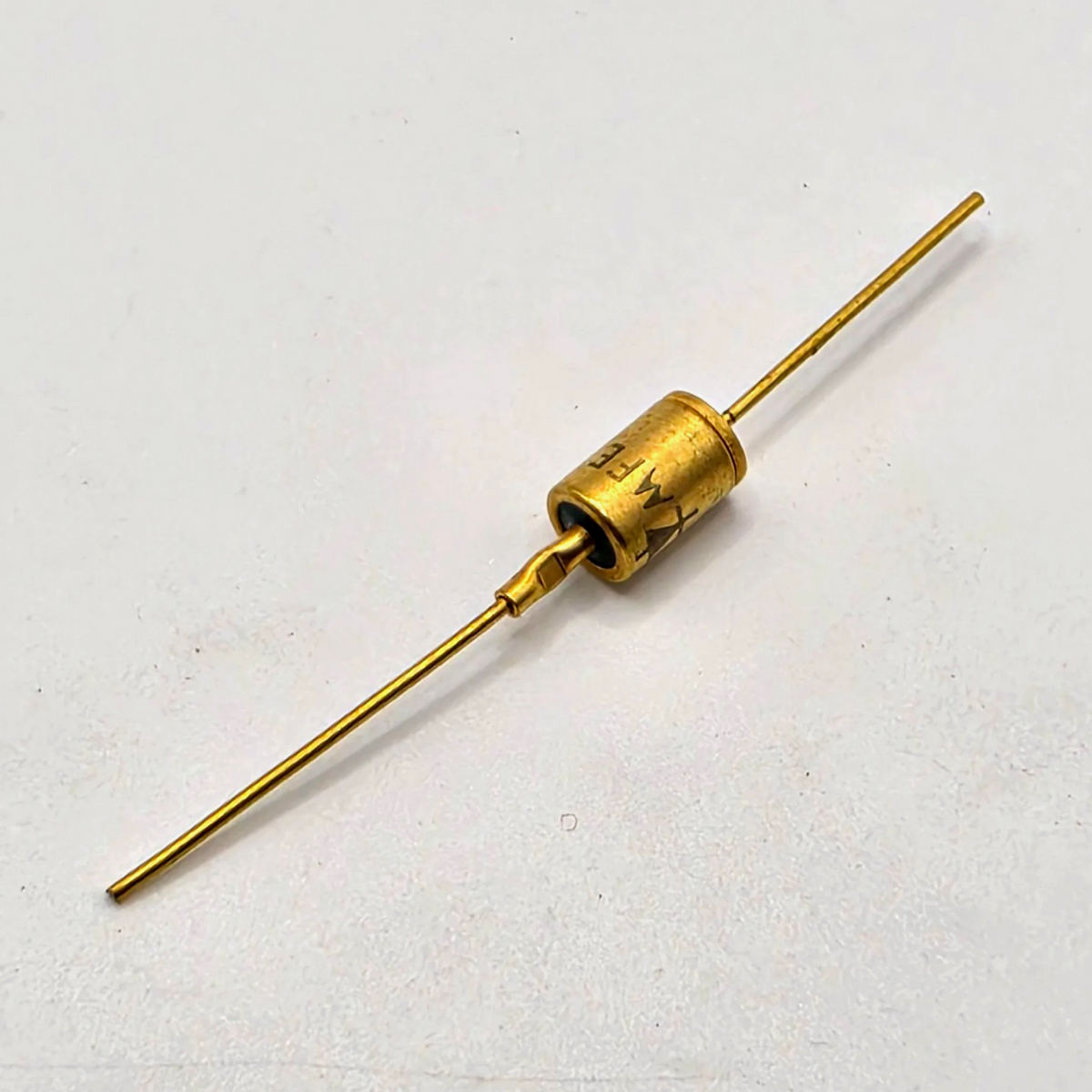 Motorola axial diode marked FE 7331 gold metal case for vintage electronics repair from American Industrial Parts Group