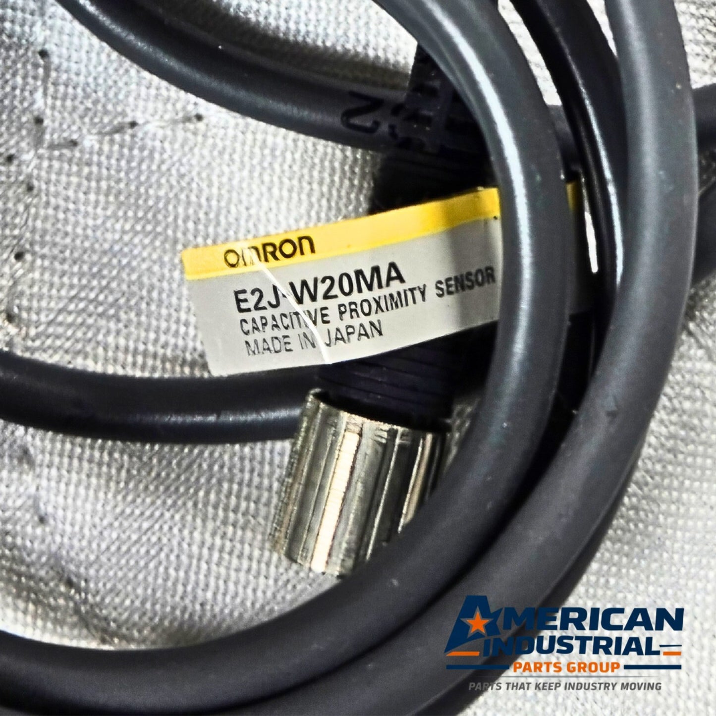 Omron E2J-W20MA capacitive proximity sensor 20mm range for industrial automation and machine sensing applications