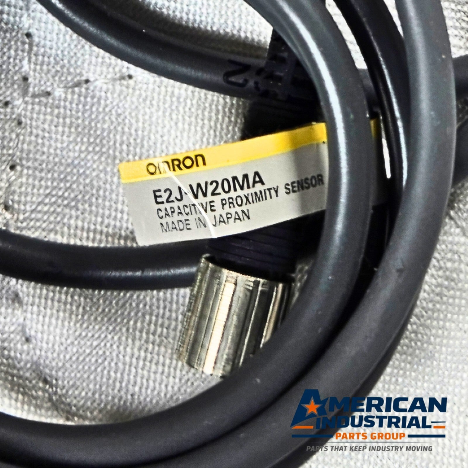 Omron E2J-W20MA capacitive proximity sensor 20mm range for industrial automation and machine sensing applications