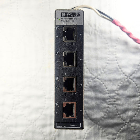 Phoenix Contact FL SFN 5TX ethernet module front view. American Industrial Parts Group.