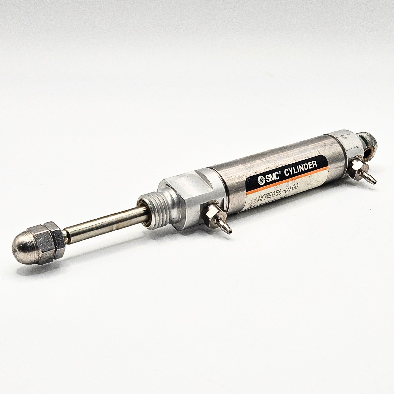 SMC NCME056-0100 pneumatic air cylinder for industrial automation and MRO applications. American Industrial Parts Group.