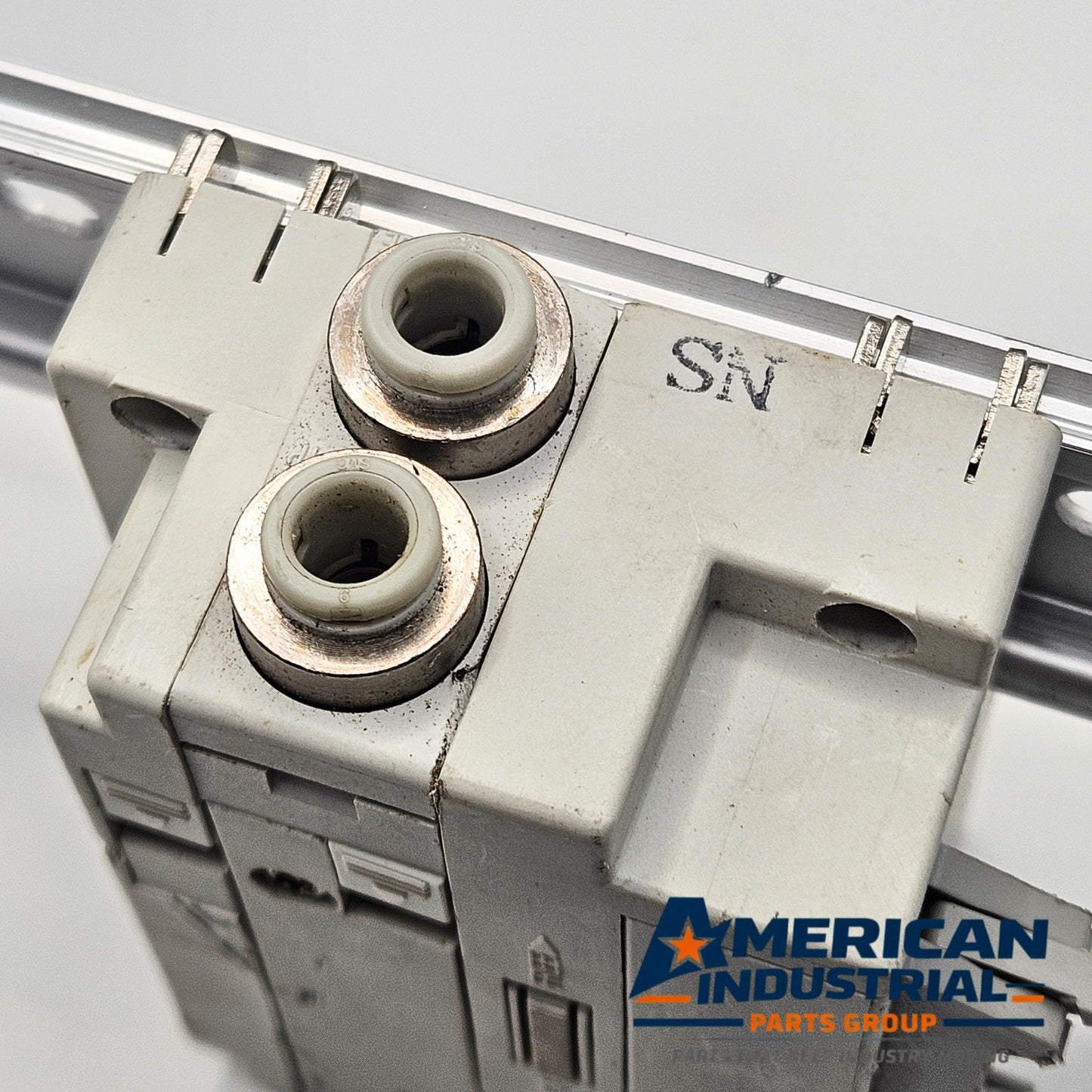 SMC pneumatic valve manifold end block multi-pin connector view, industrial automation MRO pneumatic wiring component. American Industrial Parts Group.