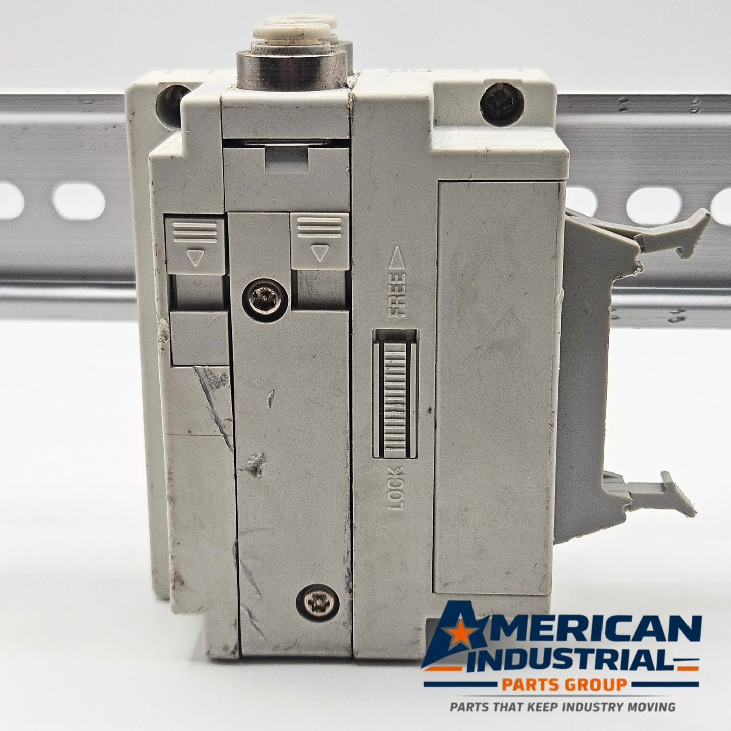 SMC pneumatic valve manifold end block terminal side view, industrial automation MRO pneumatic control component. American Industrial Parts Group.