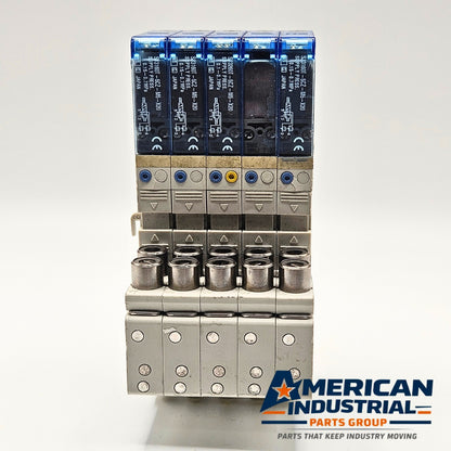 SMC SJ3160T-5CZ-M5-X20 pneumatic solenoid valve manifold lot of 5 front view, industrial automation MRO pneumatic valve assembly. American Industrial Parts Group.