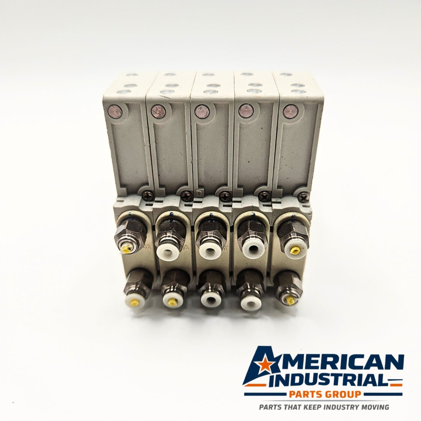SMC SJ3160T-5CZ-M5-X20 pneumatic solenoid valve manifold rear view, industrial automation MRO pneumatic control valve. American Industrial Parts Group.