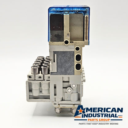 SMC SJ3160T-5CZ-M5-X20 pneumatic solenoid valve manifold side view, industrial automation MRO pneumatic control component. American Industrial Parts Group.