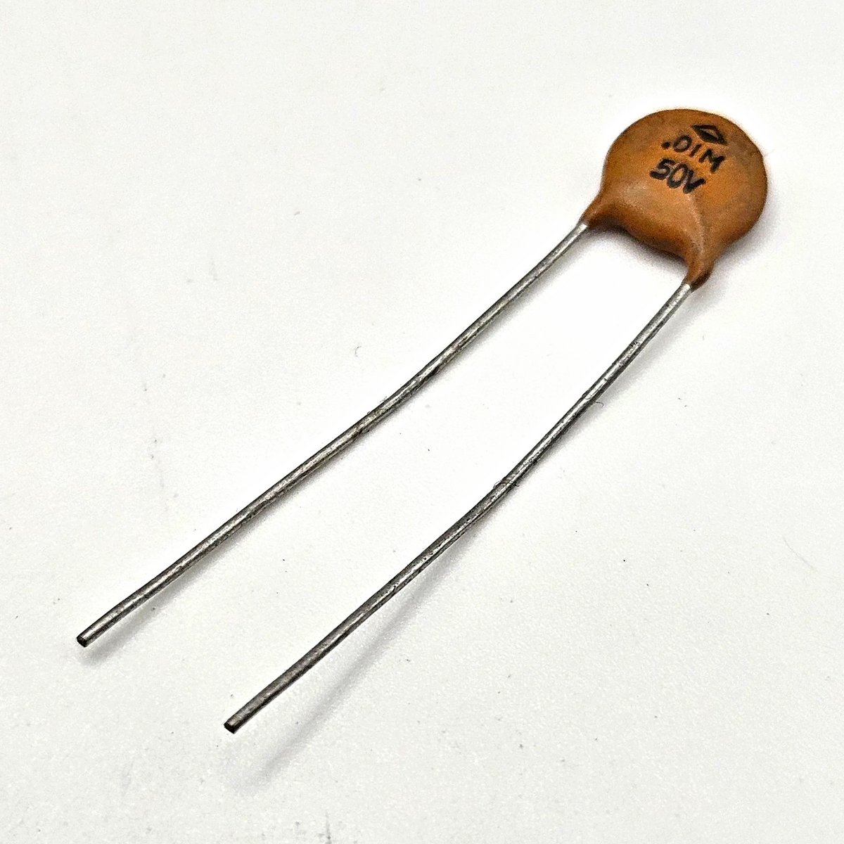 Unbranded 0.01uF 50V 10nF 103 ceramic disc capacitor radial lead for bypass, decoupling, and circuit board repair