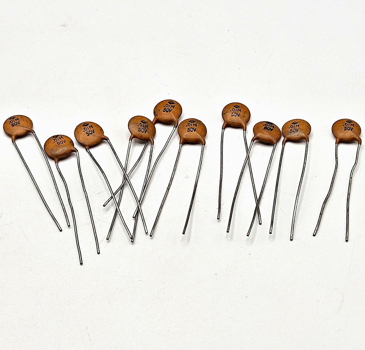 Lot of 10 unbranded 0.01uF 50V 10nF 103 ceramic disc capacitors radial lead for bypass, decoupling, and circuit board repair